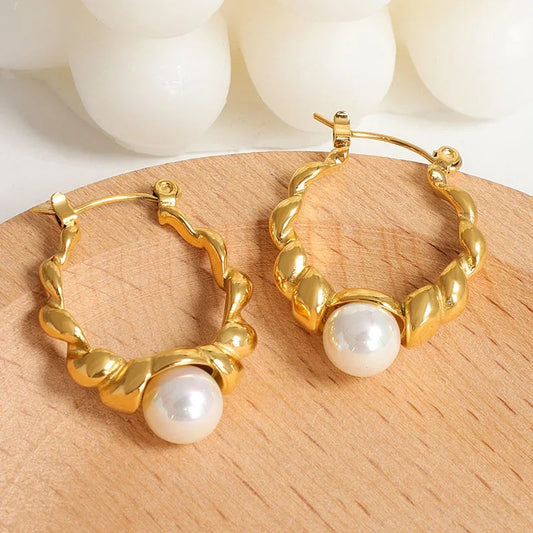 One pearl hoops